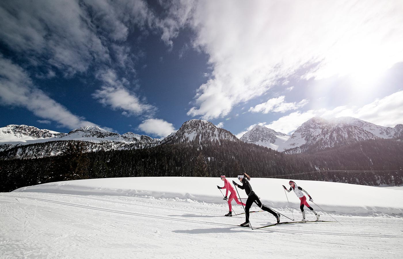 Skiers spend a day moena in winter
