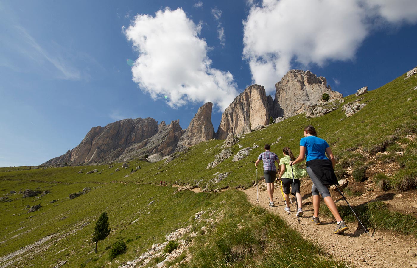 Tourists enjoy an excursion to Moena in summer