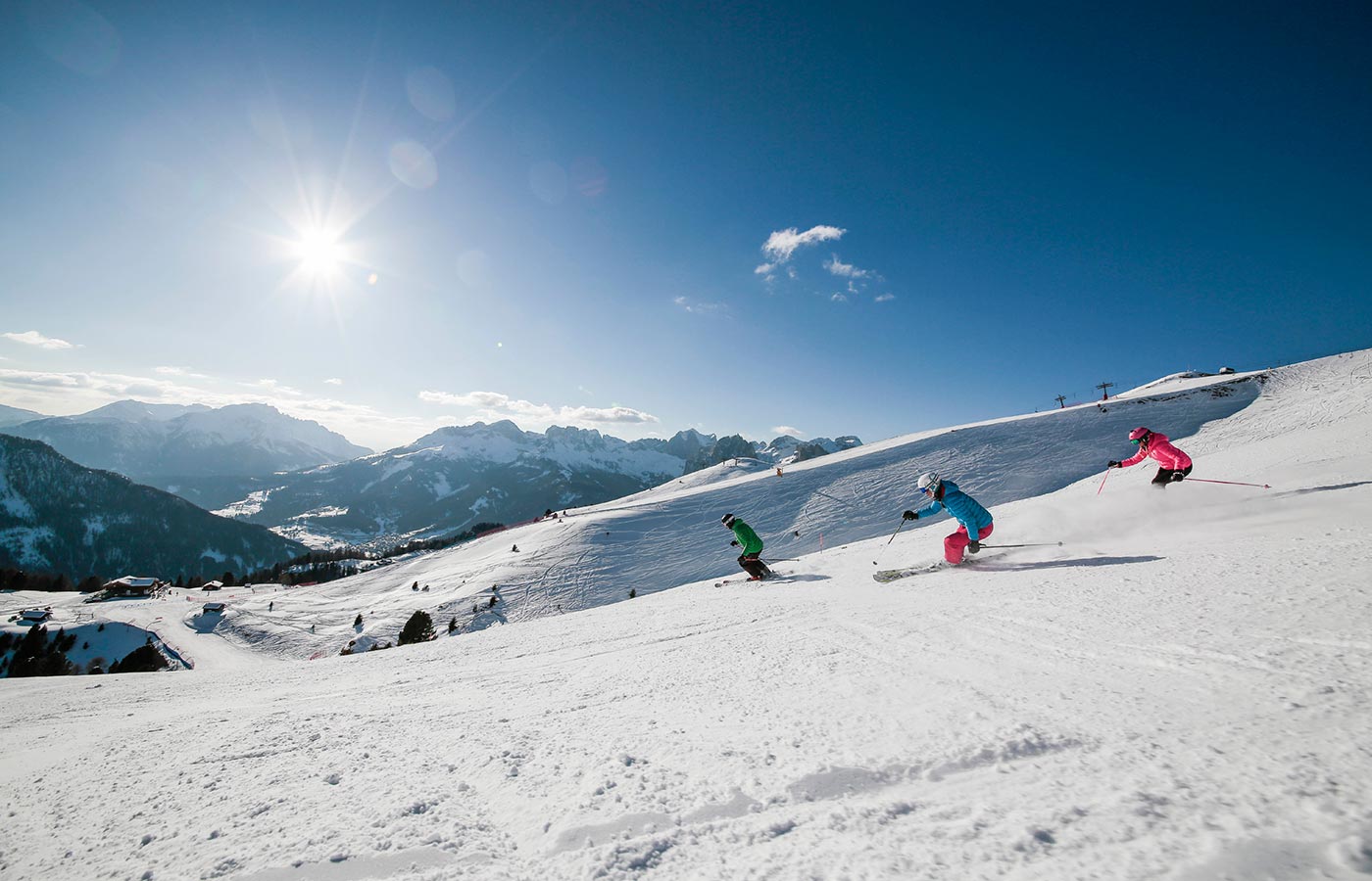 Snowboarder performs jumps and performances in Val di Fassa